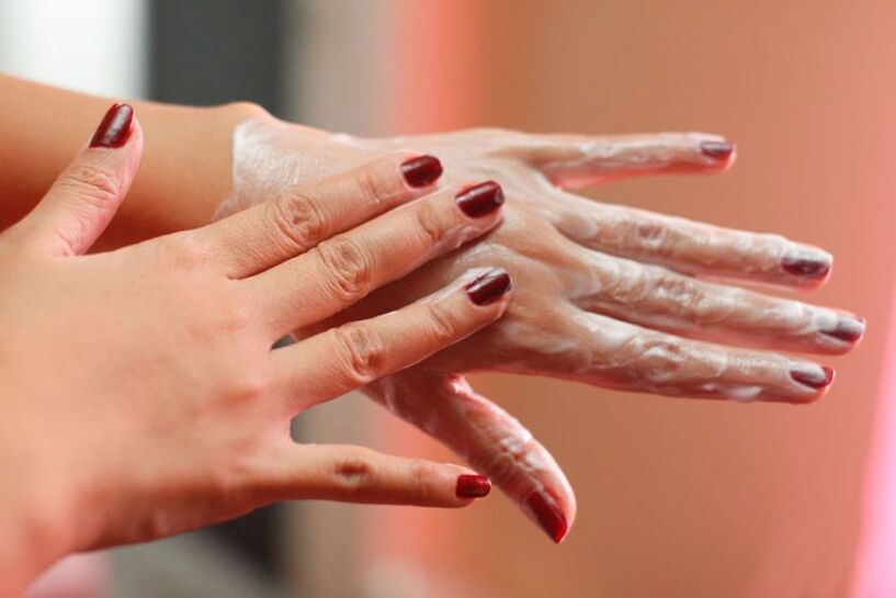 applying hand cream for skin rejuvenation
